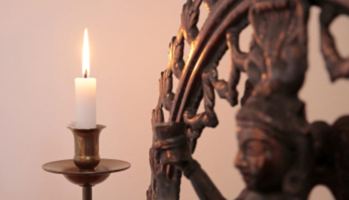 Statue Of The Goddess Shiva With Candle